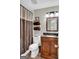 Cozy bathroom with tile flooring, granite sink, and modern towel rack at 183 Wynnmeade, Peachtree City, GA 30269
