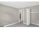 Neutral bedroom featuring an open closet and doorway to another room at 183 Wynnmeade, Peachtree City, GA 30269