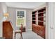 Charming bedroom featuring a desk, bookcase, chair, and bright window at 183 Wynnmeade, Peachtree City, GA 30269
