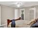 Bedroom with ceiling fan, door to backyard, and walk-in closet at 183 Wynnmeade, Peachtree City, GA 30269