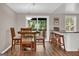 Cozy dining area with wood flooring and a sliding glass door leading to an outdoor deck at 183 Wynnmeade, Peachtree City, GA 30269