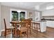 Bright dining area adjacent to the kitchen, featuring bar stool seating and natural light at 183 Wynnmeade, Peachtree City, GA 30269