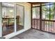 View of the screened-in porch looking into the dining room with a sliding glass door at 183 Wynnmeade, Peachtree City, GA 30269