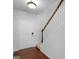 Bright entryway with hardwood floors, staircase, and a traditional white front door at 505 Mariposa Ln, Mcdonough, GA 30253