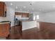 Open kitchen featuring stainless appliances, granite countertops and hardwood floors at 505 Mariposa Ln, Mcdonough, GA 30253