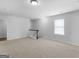 Upstairs loft featuring neutral carpet, a window, and lots of natural light at 505 Mariposa Ln, Mcdonough, GA 30253