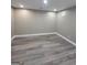 Finished basement space showcasing modern flooring and recessed lighting at 2587 Mead Ct, Jonesboro, GA 30236