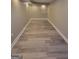 Finished basement space showcasing modern flooring and recessed lighting at 2587 Mead Ct, Jonesboro, GA 30236