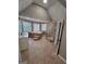 Bathroom featuring a soaking tub, a glass shower, and large windows for ample natural light at 2587 Mead Ct, Jonesboro, GA 30236