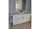 Bathroom featuring a white vanity with a black faucet and a white countertop at 2587 Mead Ct, Jonesboro, GA 30236
