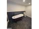 Bathroom features a clawfoot tub and black tiled floor and accent wall at 2587 Mead Ct, Jonesboro, GA 30236