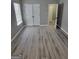 Bedroom featuring wood floors, a window, and closet with double doors at 2587 Mead Ct, Jonesboro, GA 30236