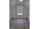 Walk-in attic closet has built-in wire racks and wood flooring at 2587 Mead Ct, Jonesboro, GA 30236