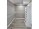 Walk-in closet with custom shelving and new wood flooring at 2587 Mead Ct, Jonesboro, GA 30236