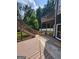 Two-level deck featuring wooden railing and stairs, with views of the surrounding landscape at 2587 Mead Ct, Jonesboro, GA 30236