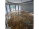 Sunlit dining area with beautiful tile floors, stylish lighting fixture, and patio doors to the deck at 2587 Mead Ct, Jonesboro, GA 30236
