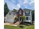 Charming two-story home boasts a manicured lawn, brick accents, and an attached two-car garage at 2587 Mead Ct, Jonesboro, GA 30236