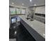 Modern kitchen with stainless steel appliances, granite countertops, and ample cabinet space at 2587 Mead Ct, Jonesboro, GA 30236