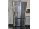 Stainless steel French door refrigerator with water and ice dispenser, and modern cabinetry at 2587 Mead Ct, Jonesboro, GA 30236