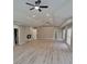 Spacious living room with new wood flooring, tray ceilings and neutral paint at 2587 Mead Ct, Jonesboro, GA 30236