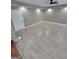 Renovated room features wood-look tile flooring, fresh paint, recessed lighting, and a ceiling fan at 2587 Mead Ct, Jonesboro, GA 30236