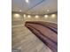Living space with gray floor and tiered, carpeted seating area at 2587 Mead Ct, Jonesboro, GA 30236