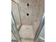 Shower stall features a tile surround with a bench and bronze hardware at 2587 Mead Ct, Jonesboro, GA 30236