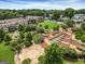 An aerial view of the community showcasing landscaped greenspace, walking paths, water features, and neighborhood housing at 53 Born St, Norcross, GA 30071