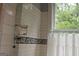 Subway tile bathroom with decorative black and white motif and large window at 53 Born St, Norcross, GA 30071