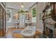 Bathroom features a clawfoot tub, fireplace, and glass door shower with double vanities at 53 Born St, Norcross, GA 30071