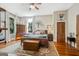 Bedroom featuring a large bed, side tables, a ceiling fan and a hardwood floor at 53 Born St, Norcross, GA 30071