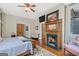 Bedroom with fireplace, seating area and connecting doors and ensuite bathroom at 53 Born St, Norcross, GA 30071