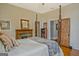 Charming bedroom with a fireplace, hardwood floors, and a four-poster bed at 53 Born St, Norcross, GA 30071