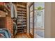 Spacious closet with built-in shelving and drawers, conveniently attached to the primary bathroom at 53 Born St, Norcross, GA 30071