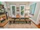 Rustic dining room with a long wooden table, bench seating, and a fireplace at 53 Born St, Norcross, GA 30071