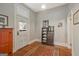 Entryway featuring hardwood floors, vintage cabinet and charming decorations at 53 Born St, Norcross, GA 30071