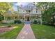 Inviting two-story home with a brick pathway, front porch, and well-maintained lawn at 53 Born St, Norcross, GA 30071