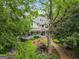 Charming two-story home with a sprawling porch and manicured lawn and garden at 53 Born St, Norcross, GA 30071