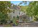 Spacious backyard with patio, grill, and mature trees surrounding charming two-story home at 53 Born St, Norcross, GA 30071