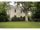Charming two-story home with a screened-in porch and lush green lawn at 53 Born St, Norcross, GA 30071