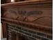 Close up of a beautiful fireplace with an ornate, carved wood mantel and a tiled hearth at 53 Born St, Norcross, GA 30071