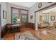 Inviting entryway with hardwood floors, decorative table, and doorway leading to living space at 53 Born St, Norcross, GA 30071