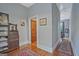 Hallway featuring wood floors, neutral walls and views to other rooms with vintage accents at 53 Born St, Norcross, GA 30071