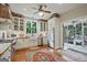 Classic kitchen with white cabinets, stainless steel appliances, and a farmhouse sink at 53 Born St, Norcross, GA 30071