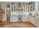 Well-equipped kitchen boasts white cabinetry, stainless steel appliances, and a Wolf range at 53 Born St, Norcross, GA 30071