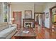Spacious living room with hardwood floors, a cozy fireplace, and ample natural light at 53 Born St, Norcross, GA 30071