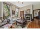 Inviting living room featuring a fireplace, large windows, and classic details at 53 Born St, Norcross, GA 30071