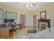 Bright living room boasts a fireplace, wood flooring and a comfortable sitting area with a sofa at 53 Born St, Norcross, GA 30071