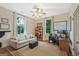 Cozy living room features a fireplace, hardwood floors, and lots of natural light from two windows at 53 Born St, Norcross, GA 30071