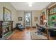 Home office with a decorative fireplace, hardwood floors, and plenty of workspace at 53 Born St, Norcross, GA 30071